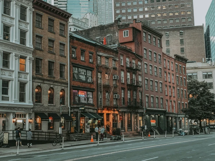 a row of buildings are shown on the street