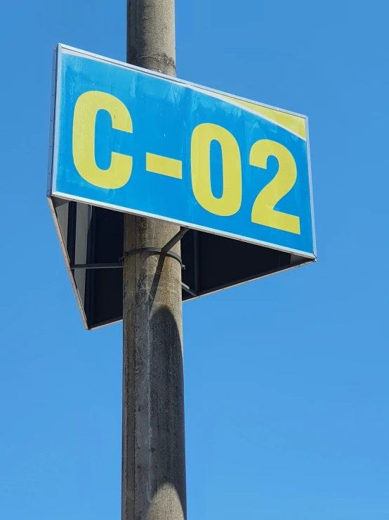 a street sign hanging off of a wooden pole