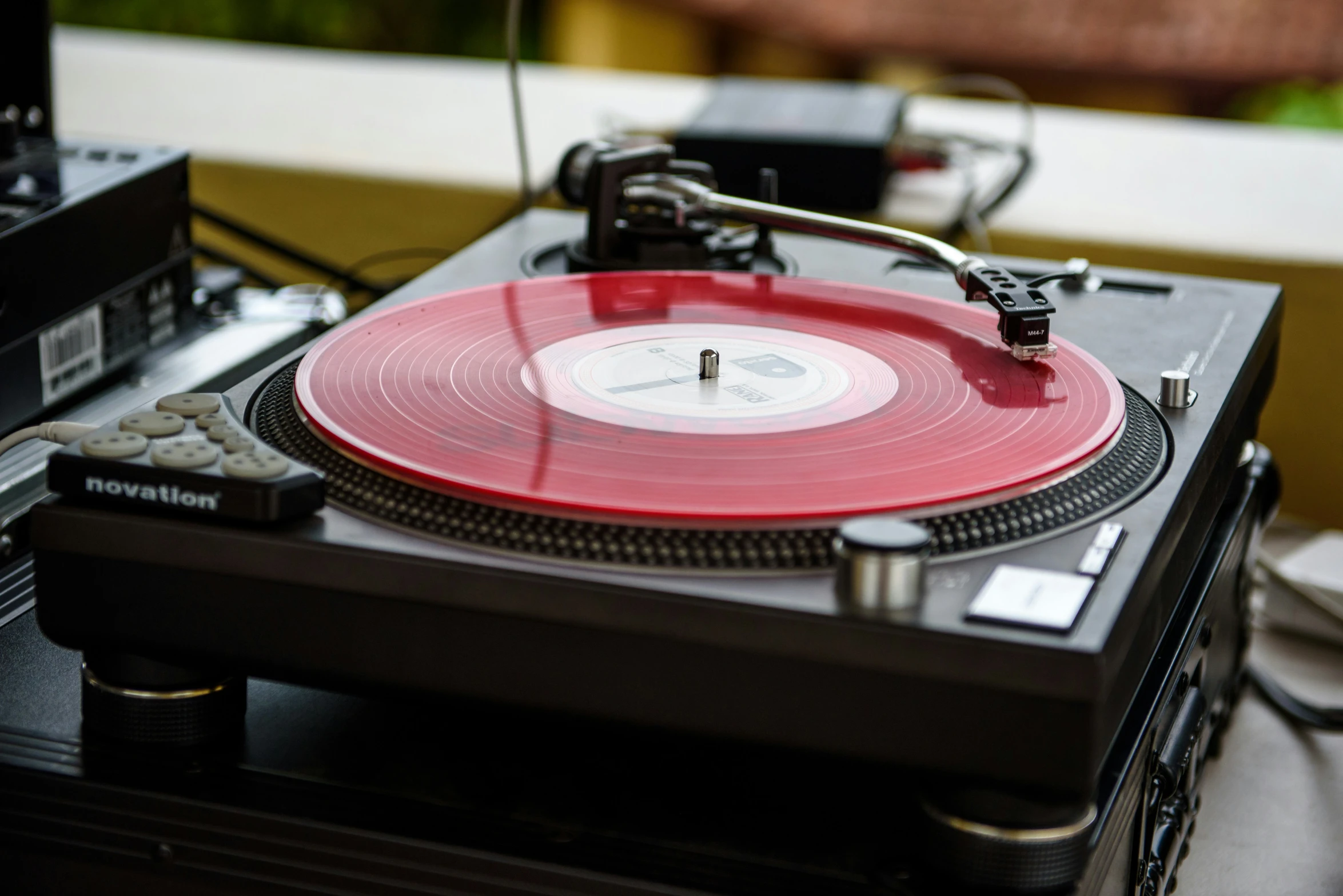 an old record player sitting next to a stereo player