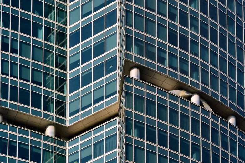 a very tall building with some white light in front of it