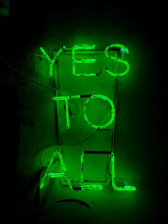 a very odd lit sign saying yes to all