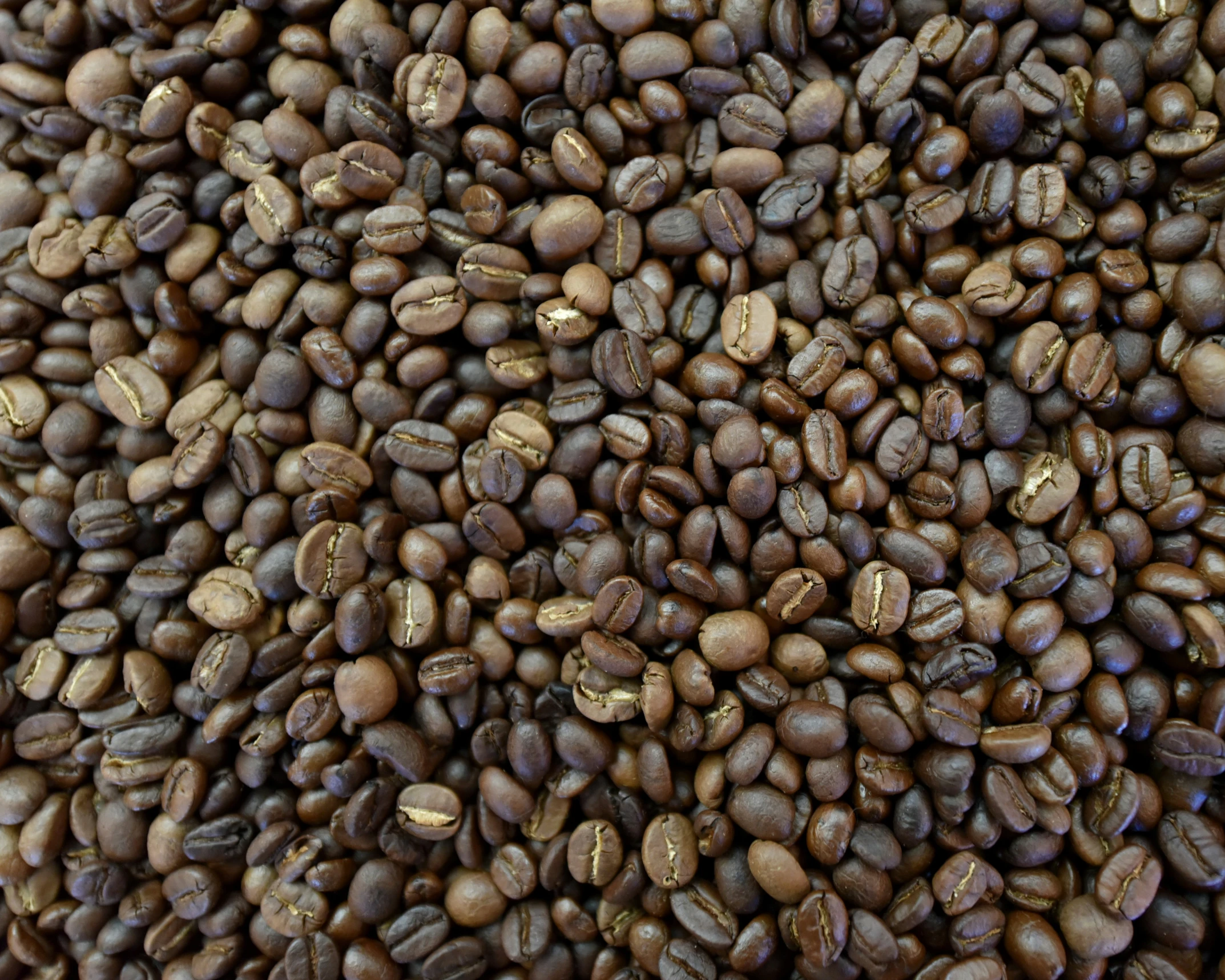 a pile of coffee beans sitting in front of each other