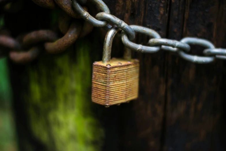 an open padlock with the chain attached