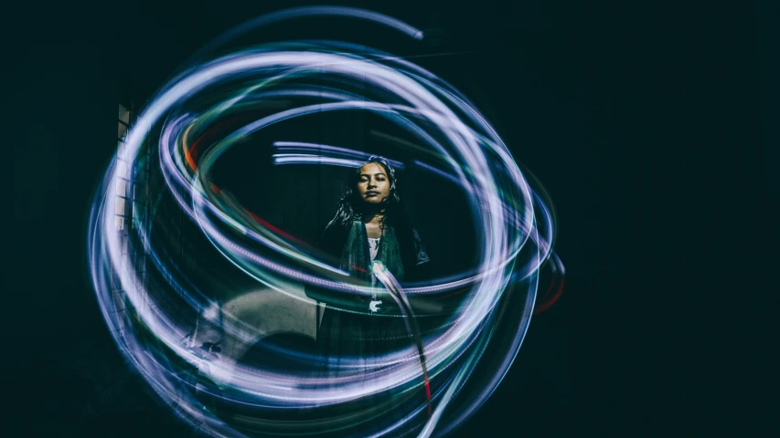 the blurry picture shows a person's face and hair as they hold their camera in a loop