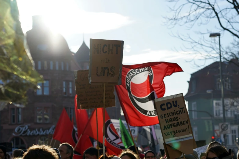 several people on the streets protesting in protest