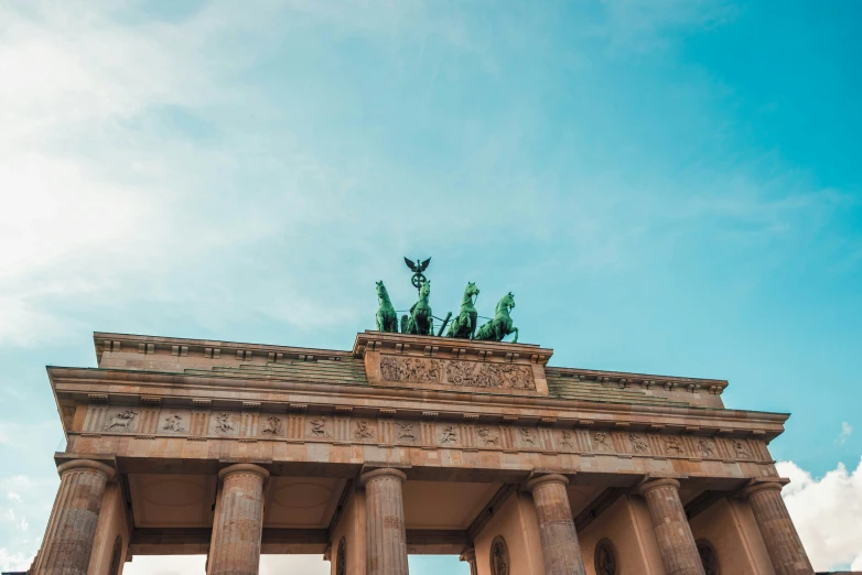 the arch on the left has statues on top