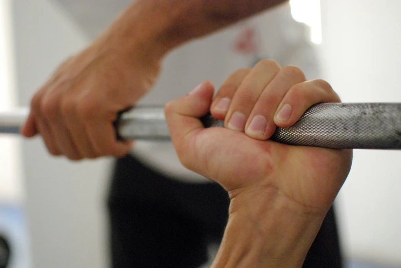 a close up of a person doing soing with a stick