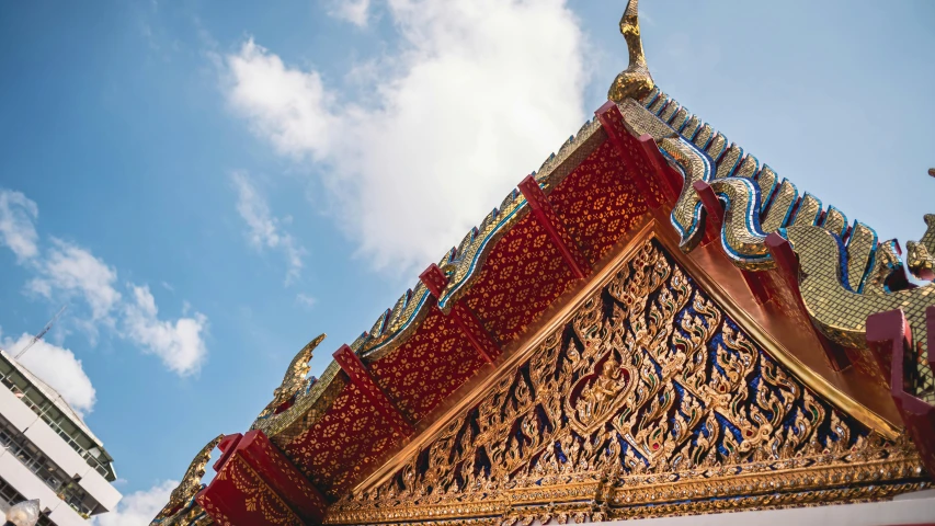 a golden building with a decoratively decorated roof