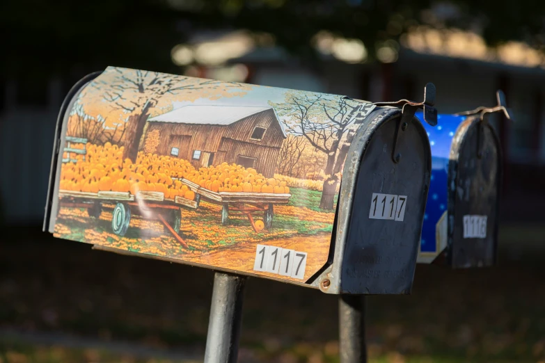 two mail boxes with thanksgiving paintings on them