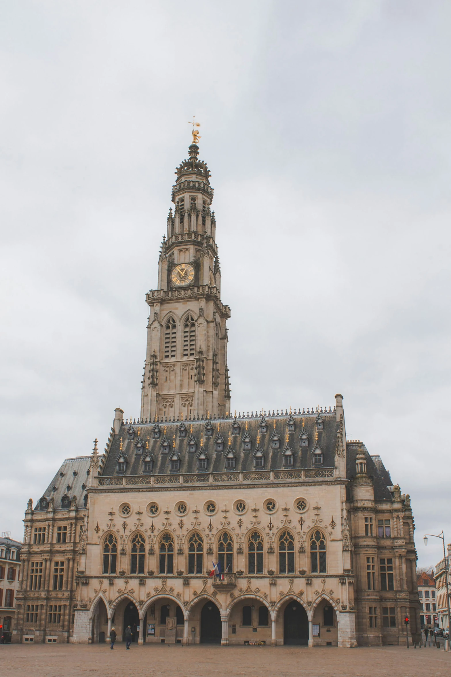 a very tall building with some clocks on the top of it