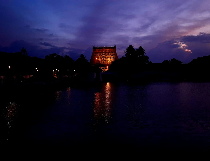 the clock tower lights up on the lake