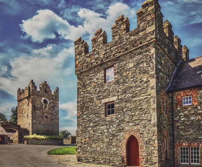 an old castle on the side of a road