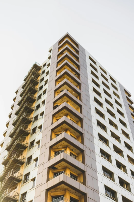 a tall building with multiple stories at the top of it