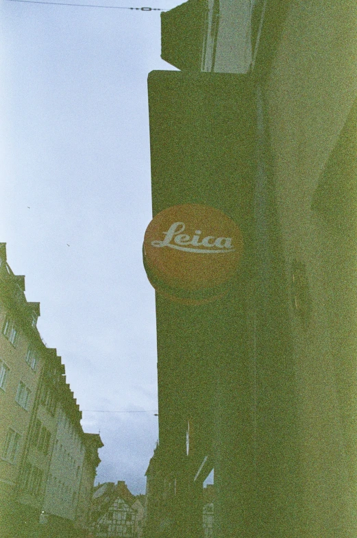 a po of a street sign in a blurred foreground