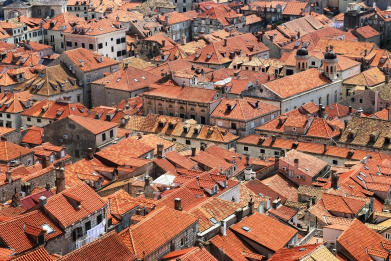 the view of a city with red rooftops