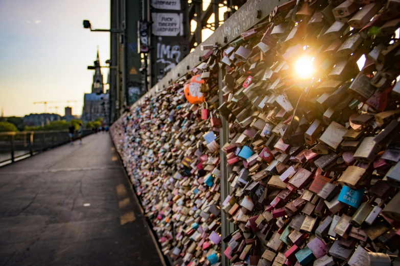 a wall covered with locks and notes of love