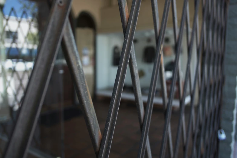 an old iron fence with some reflections in it