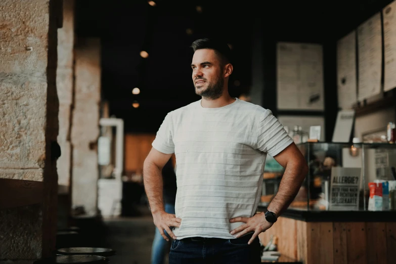 a man in a white shirt is standing