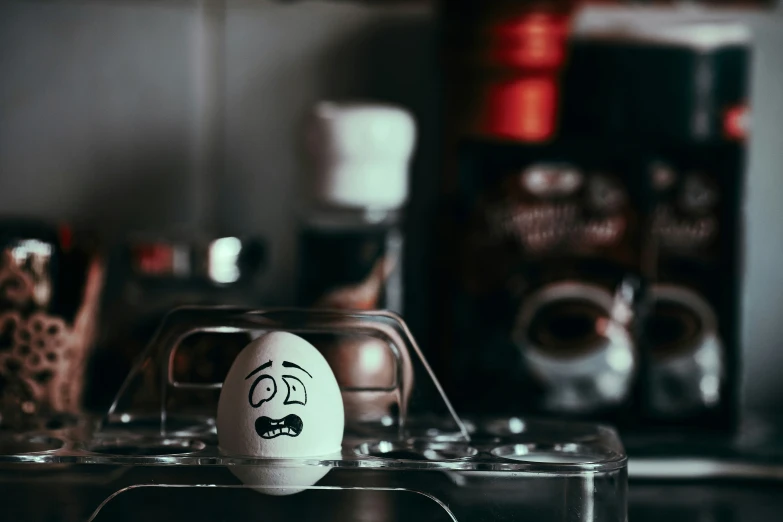 egg is sitting on top of a clear container