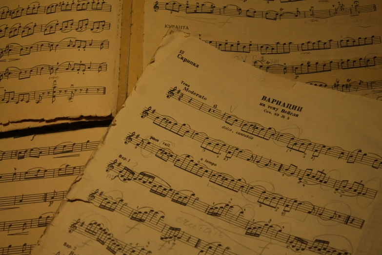 sheet music sitting next to an old book