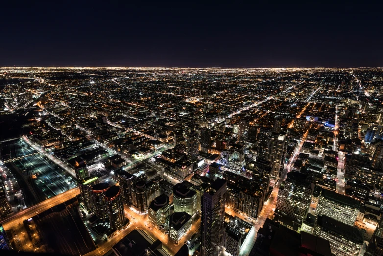a night view of the city lights from a very high rise building