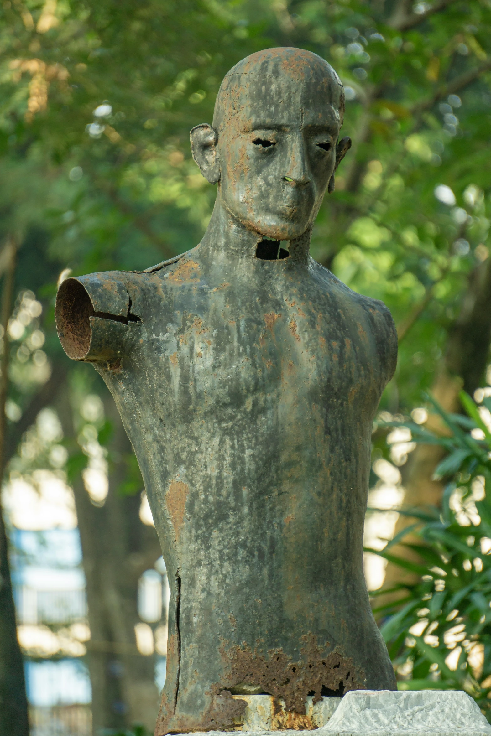 a small statue with a face painted brown