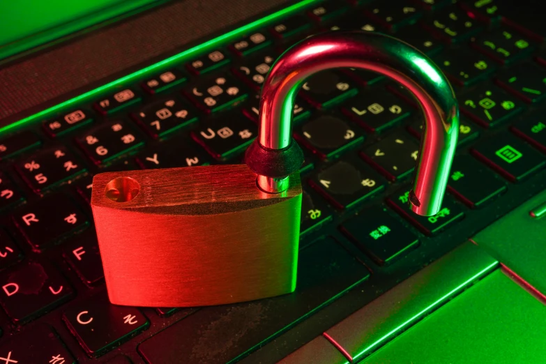 a padlock attached to a computer keyboard