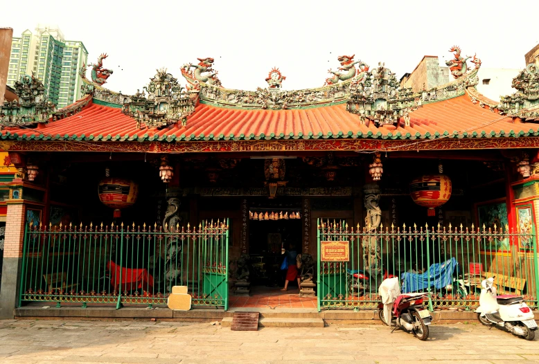 a street scene showing people sitting outside a building