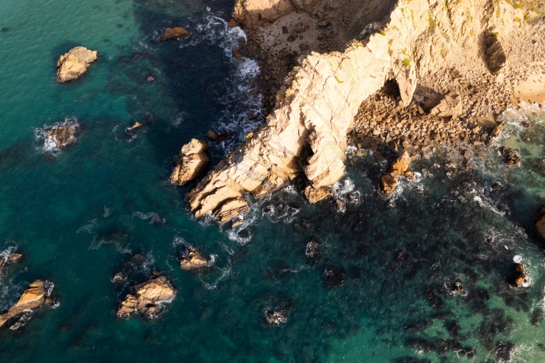 aerial s of some rocks and water with an airplane