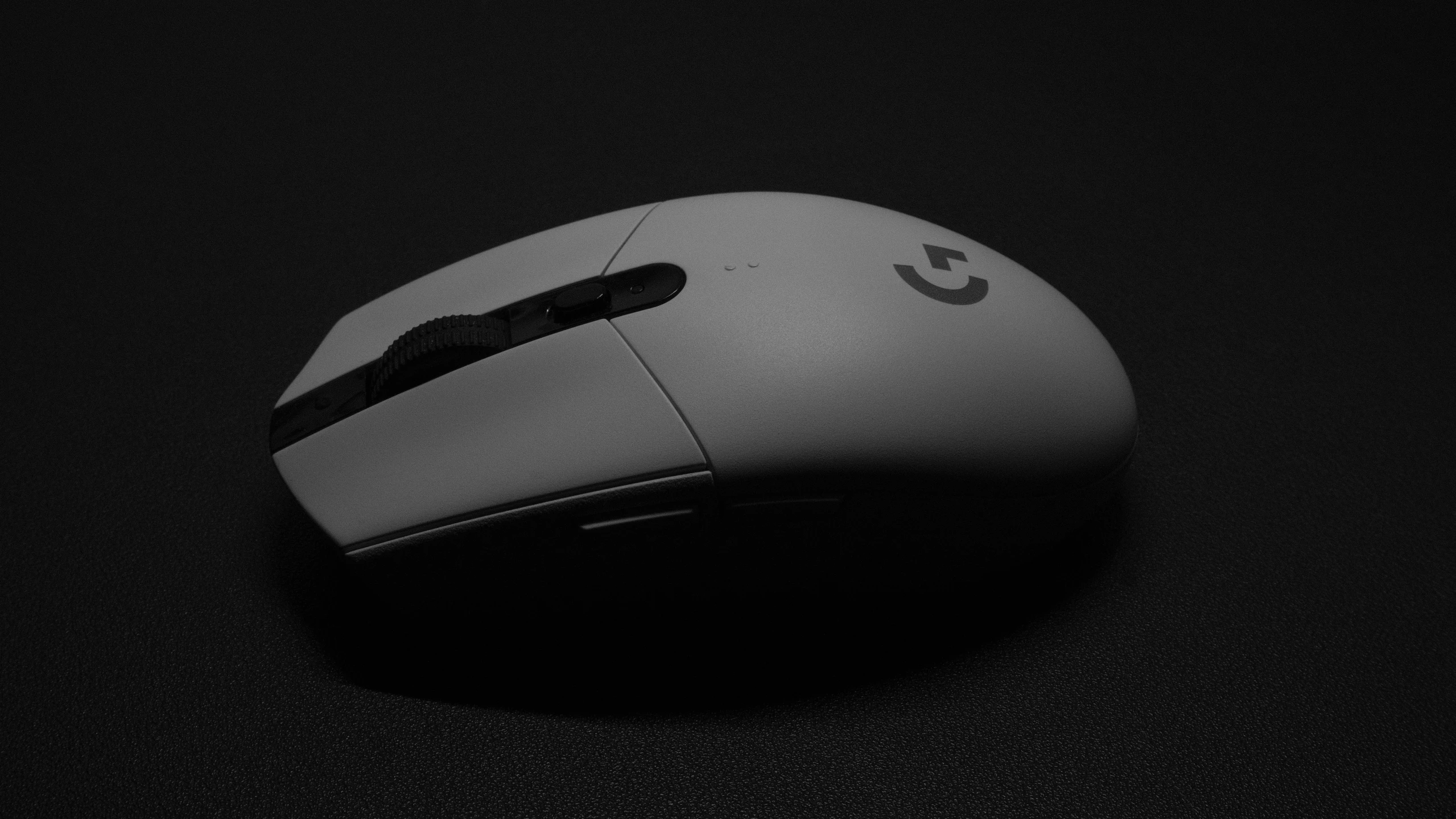 a black mouse with white writing on it