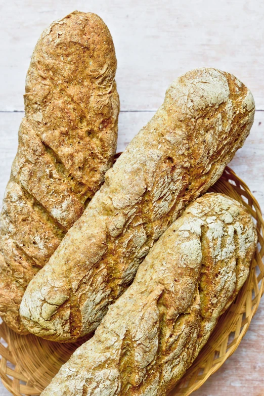 two loaves of bread in a woven basket