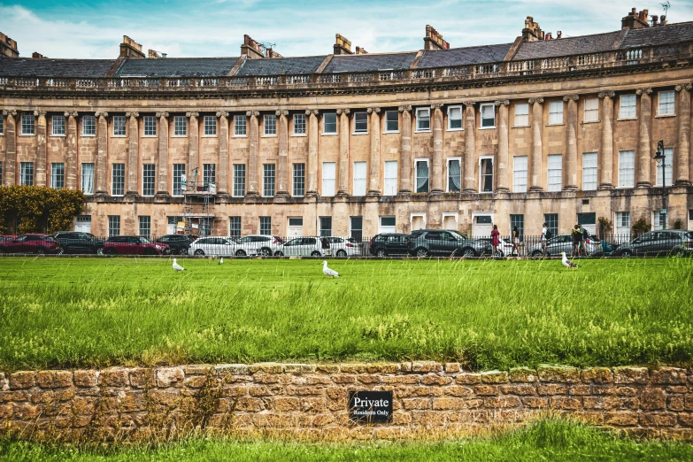 a huge building that is in the middle of a field