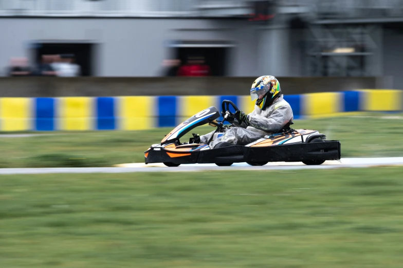 a man is on a go cart with two seats