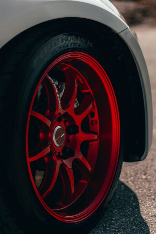 a close up of the wheel of a sports car