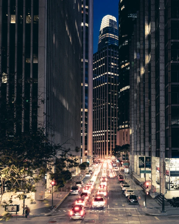 cars and streetlights are all on a city road