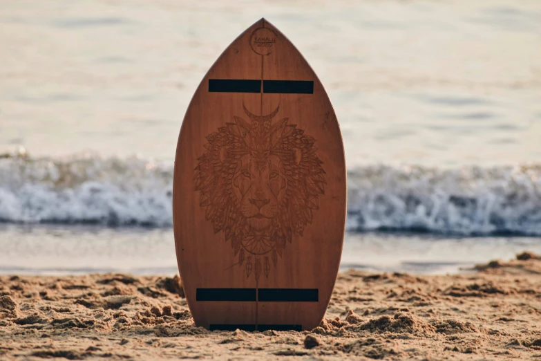 a surf board sitting upright on a beach