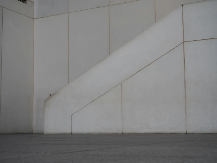 a man is walking towards a stair case