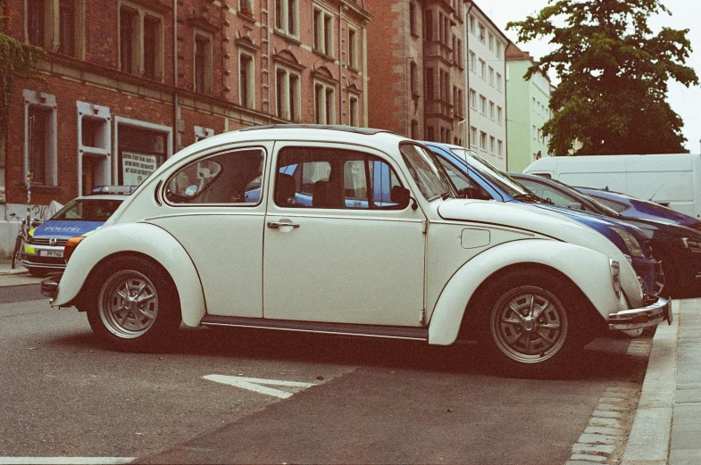 a close up of a car on a street near a building