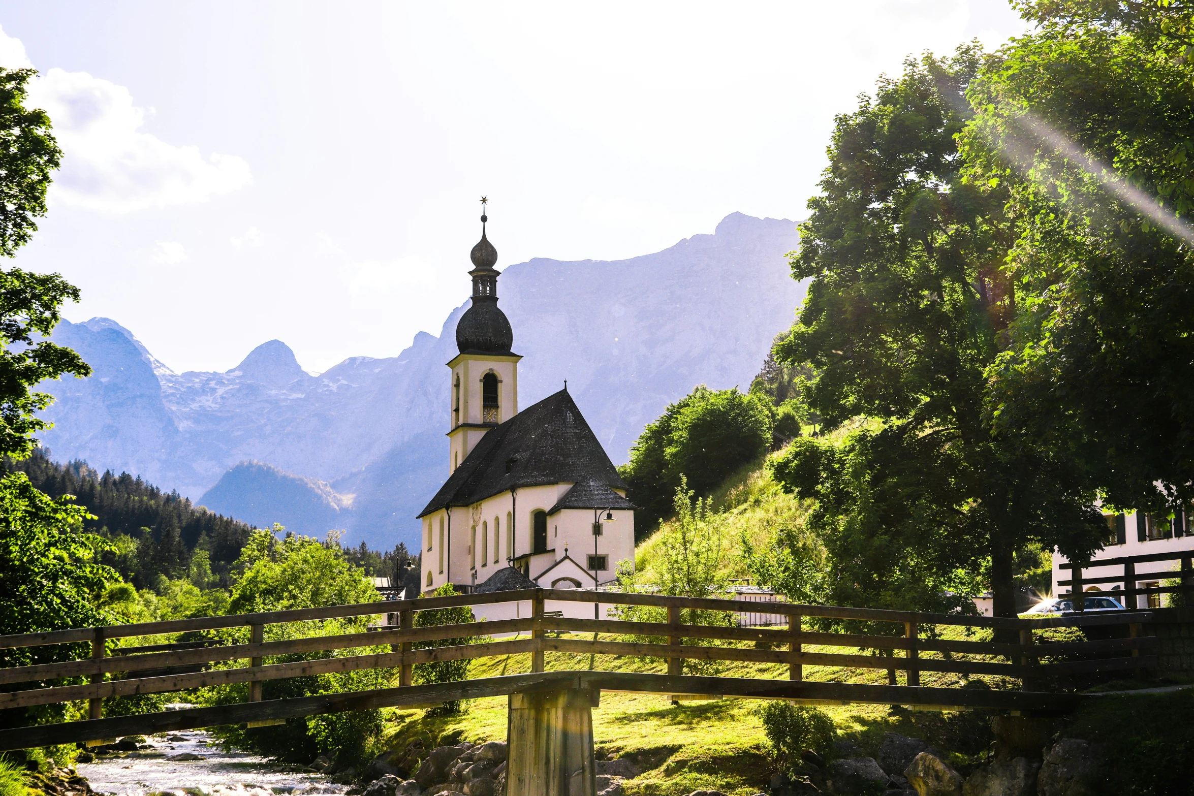 a white church with a steeple in the background