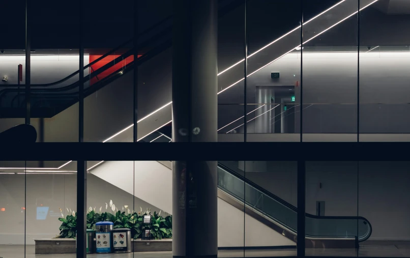 a couple of sets of glass walls with a staircase