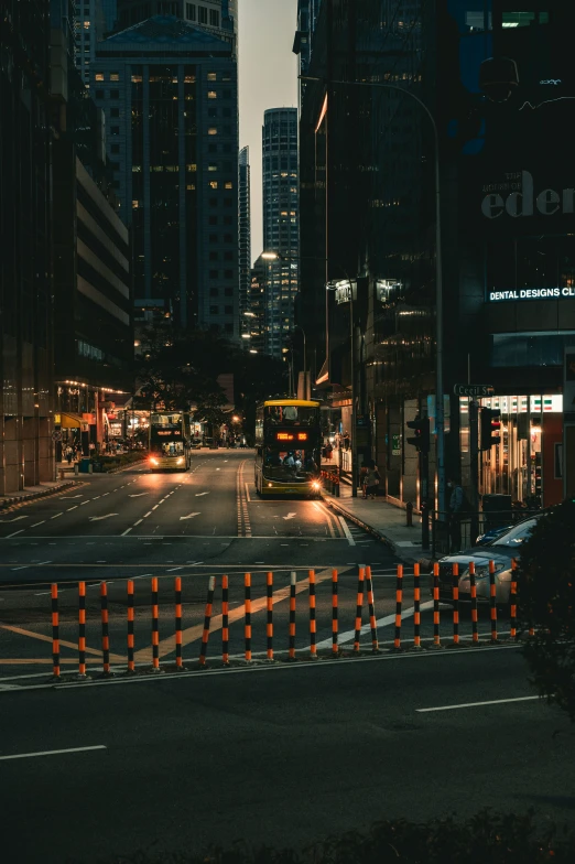 there are traffic lights at night and traffic lines are orange