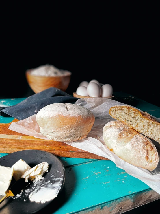 bread, er, and two cups on a table