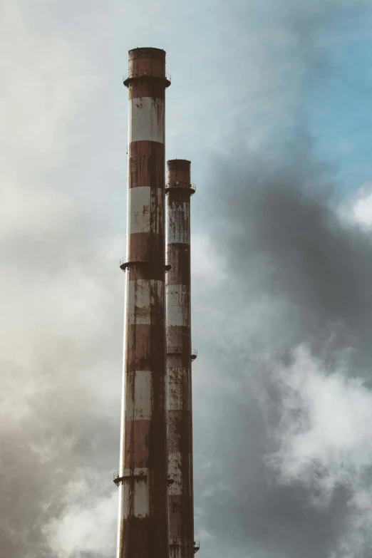 smoke stacks sticking out from a tall building