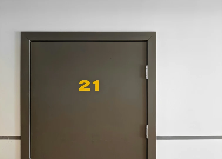 the door is closed and numbers are displayed on the wall