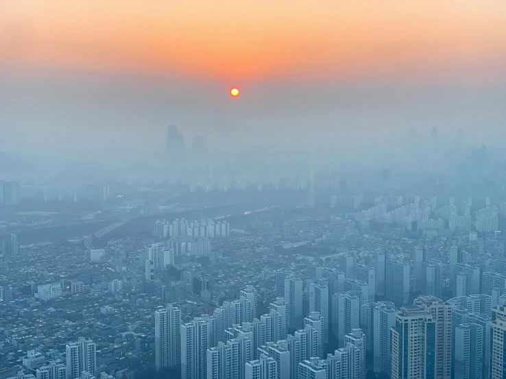 a hazy view of some very tall buildings