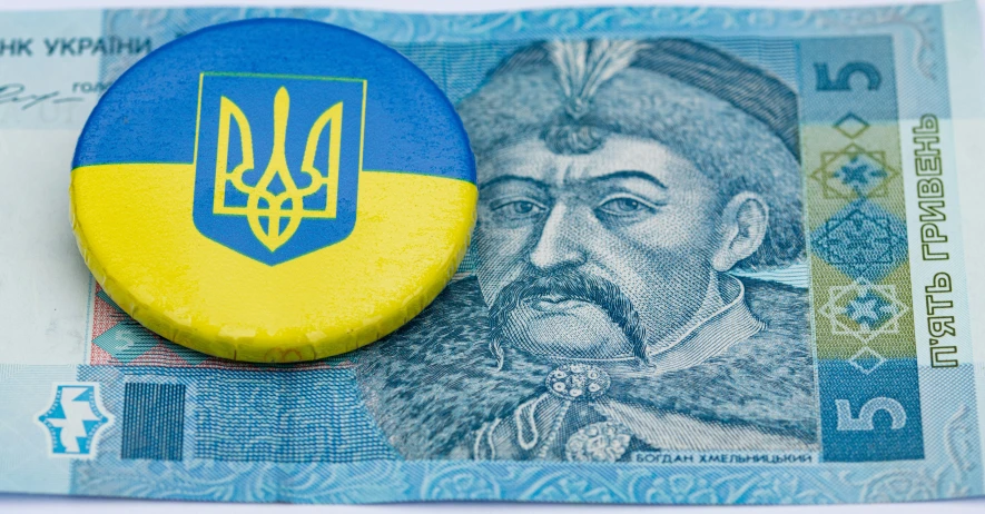 a ukraine and an american dollar bill