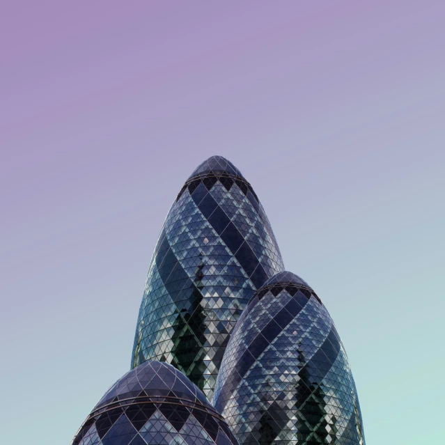 the blue glass building of london with a purple sky in the background