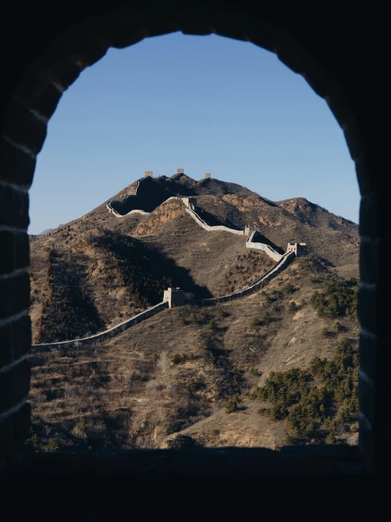 the view of a section of the great wall taken through an arch