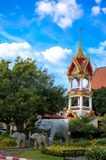 the carousel tower has elephants in front