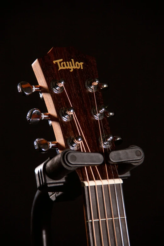 an ukulele with water droplets on the neck